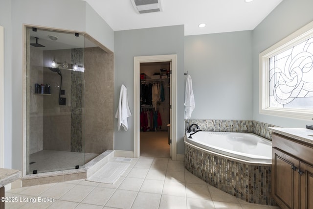 12206 Bridgeway Ct, Sellersburg, IN 47172 - full bath featuring a bath, visible vents, a shower stall, vanity, and tile patterned flooring