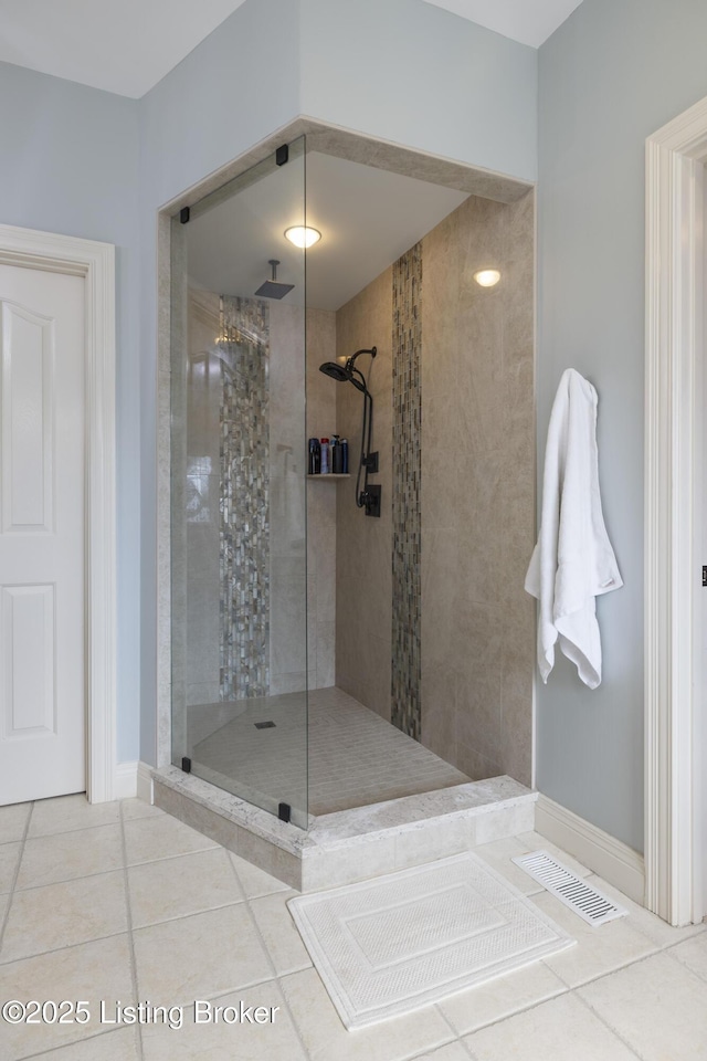 12206 Bridgeway Ct, Sellersburg, IN 47172 - bathroom featuring tile patterned floors, tiled shower, and baseboards