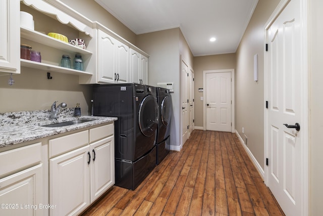 12206 Bridgeway Ct, Sellersburg, IN 47172 - washroom featuring washing machine and dryer, crown molding, a sink, wood finished floors, and cabinet space