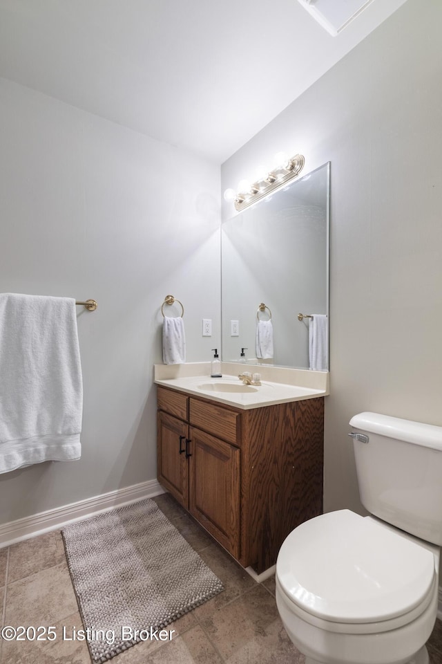 12206 Bridgeway Ct, Sellersburg, IN 47172 - bathroom with toilet, vanity, and baseboards