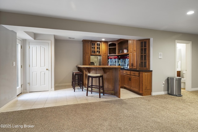 12206 Bridgeway Ct, Sellersburg, IN 47172 - bar featuring stainless steel refrigerator, recessed lighting, light tile patterned floors, light carpet, and indoor wet bar