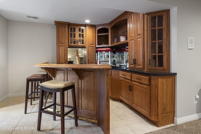 12206 Bridgeway Ct, Sellersburg, IN 47172 - bar featuring light tile patterned flooring, bar area, built in fridge, baseboards, and visible vents
