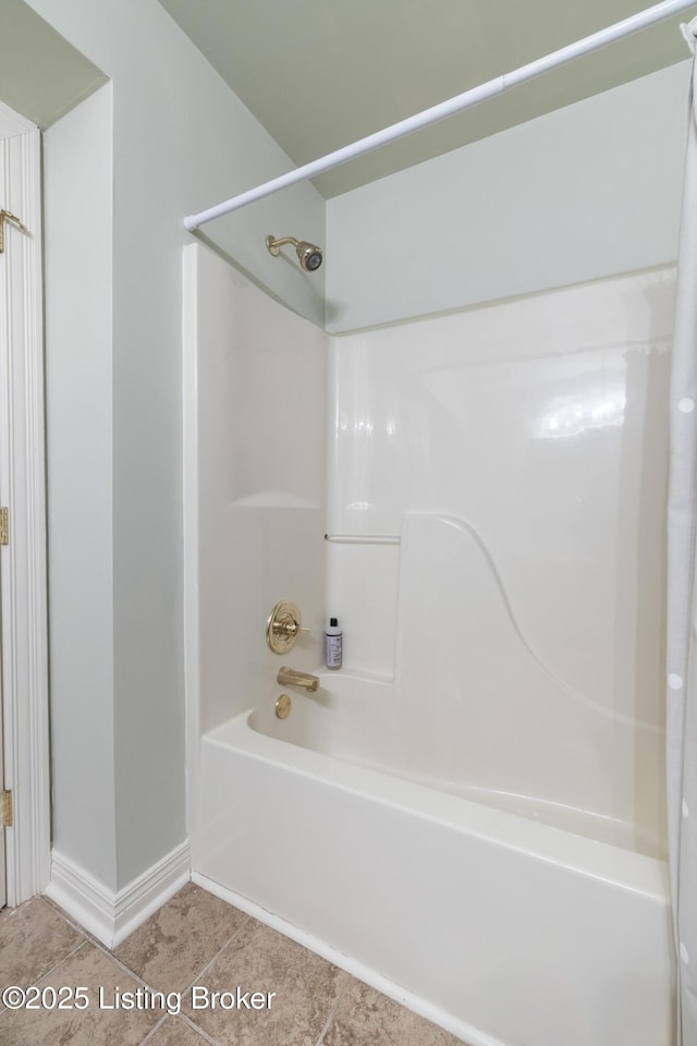 12206 Bridgeway Ct, Sellersburg, IN 47172 - bathroom with tile patterned floors, shower / washtub combination, and baseboards