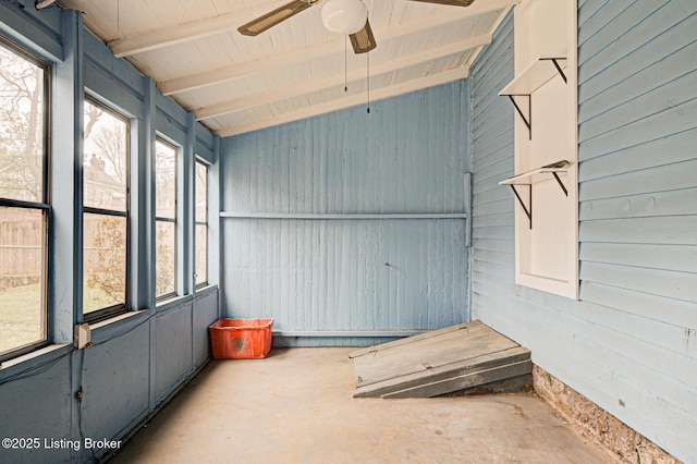 unfurnished sunroom with beam ceiling and a ceiling fan