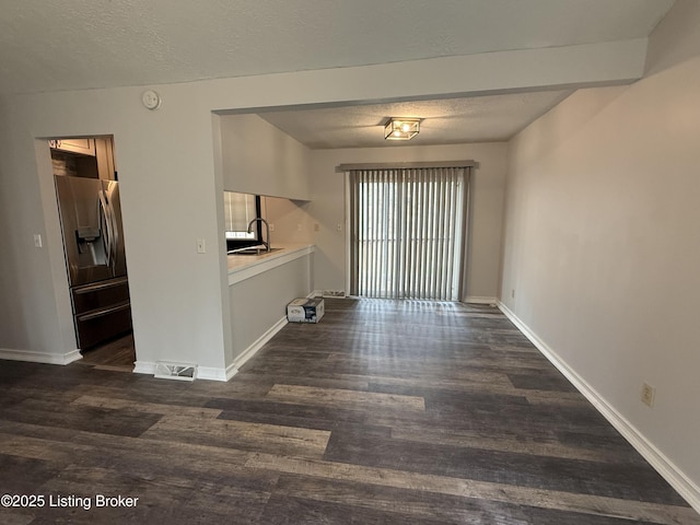 386 Pine Ridge Dr, Brandenburg, KY 40108 - interior space with visible vents, a sink, dark wood-type flooring, and a textured ceiling