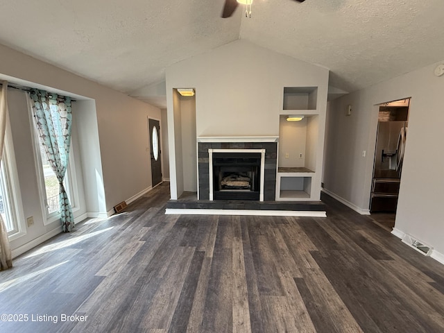386 Pine Ridge Dr, Brandenburg, KY 40108 - unfurnished living room with wood finished floors, a textured ceiling, lofted ceiling, and ceiling fan
