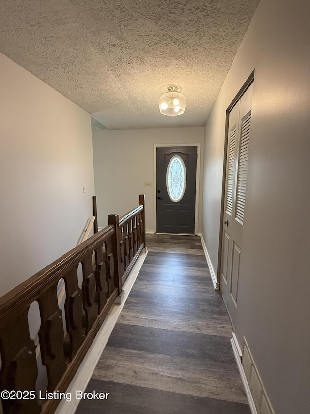 386 Pine Ridge Dr, Brandenburg, KY 40108 - doorway with baseboards, visible vents, a textured ceiling, and wood finished floors