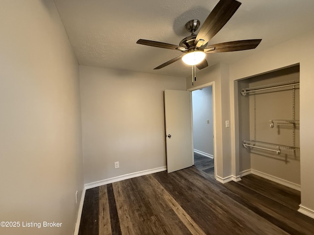 386 Pine Ridge Dr, Brandenburg, KY 40108 - unfurnished bedroom featuring a closet, dark wood-style floors, baseboards, and a textured ceiling