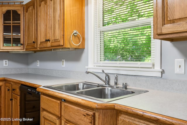6515 Upper Hunters Trce, Louisville, KY 40216 - kitchen featuring brown cabinetry, a sink, light countertops, glass insert cabinets, and black dishwasher