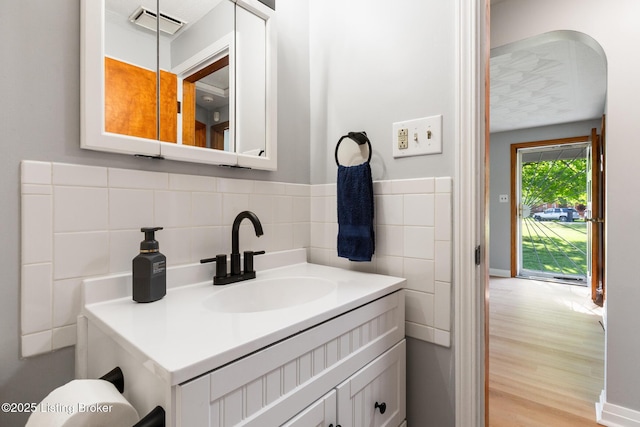 6515 Upper Hunters Trce, Louisville, KY 40216 - bathroom with visible vents, wood finished floors, and vanity