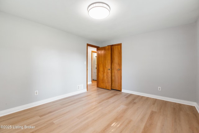 6515 Upper Hunters Trce, Louisville, KY 40216 - spare room featuring baseboards, visible vents, and light wood finished floors