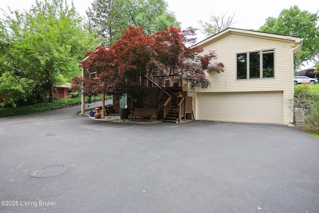 7812 Crown Top Rd, Louisville, KY 40241 - view of front of house with asphalt driveway, stairs, and an attached garage