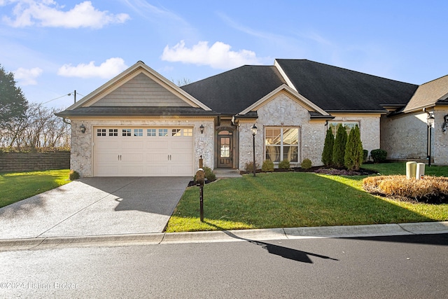 view of front facade featuring a front lawn, driveway, stone siding, and a garage