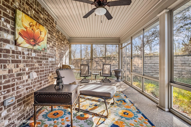 sunroom featuring a wealth of natural light and ceiling fan