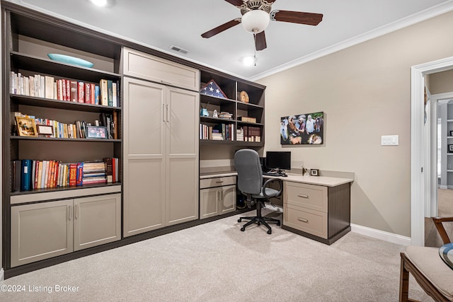 office space featuring visible vents, crown molding, baseboards, ceiling fan, and carpet floors