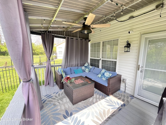 exterior space with an outdoor hangout area and a ceiling fan