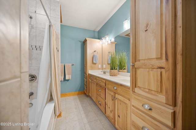 105 Moutardier Woods Way, Leitchfield, KY 42754 - bathroom featuring a sink, shower / bath combo, tile patterned flooring, baseboards, and double vanity