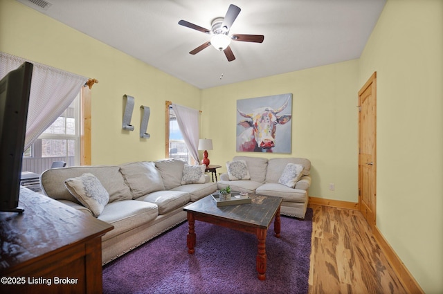 105 Moutardier Woods Way, Leitchfield, KY 42754 - living area with plenty of natural light, baseboards, wood finished floors, and a ceiling fan
