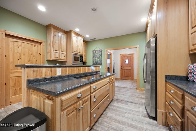 105 Moutardier Woods Way, Leitchfield, KY 42754 - kitchen featuring recessed lighting, dark countertops, light wood finished floors, visible vents, and appliances with stainless steel finishes