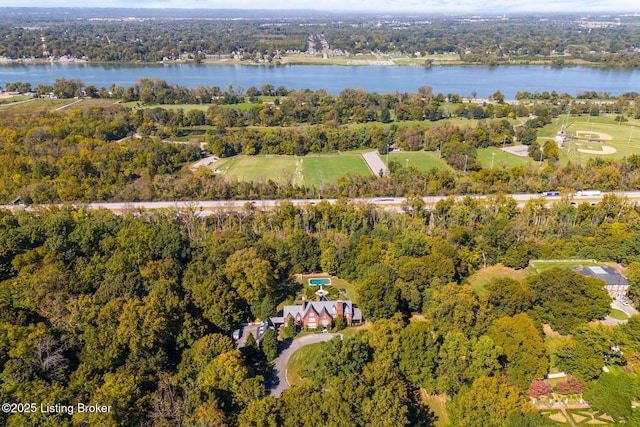 bird's eye view with a wooded view and a water view
