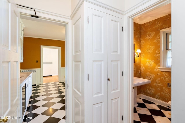 bathroom with tile patterned floors, a closet, and wallpapered walls