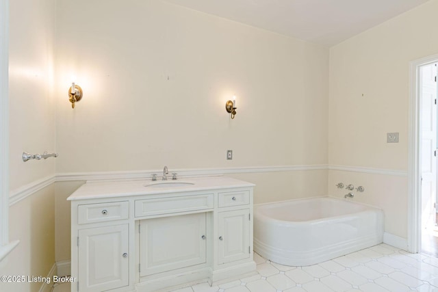 full bath with vanity and a garden tub