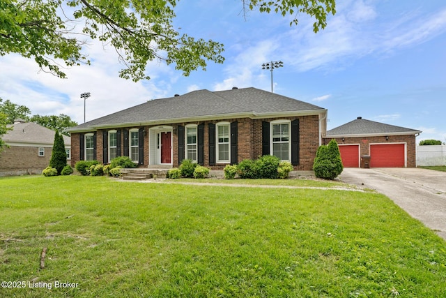 4904 Ruby Way, Shepherdsville, KY 40165 - view of front facade featuring a front lawn, driveway, and brick siding