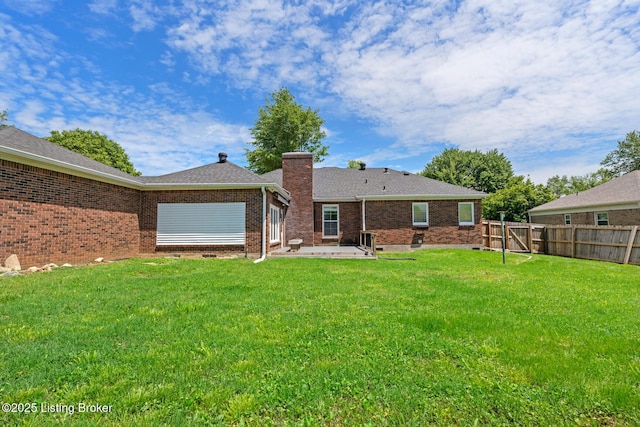 4904 Ruby Way, Shepherdsville, KY 40165 - rear view of property featuring a chimney, a patio, brick siding, and roof with shingles