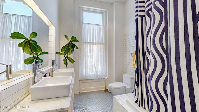 1031 S 4th St, Louisville, KY 40203 - bathroom featuring toilet, tile patterned floors, a sink, and curtained shower