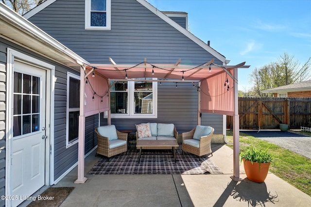 view of patio with an outdoor living space, a pergola, and fence