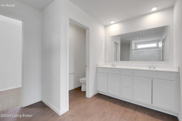 3013 Cherry Glen Dr, La Grange, KY 40031 - bathroom with toilet, a sink, wood finished floors, baseboards, and double vanity
