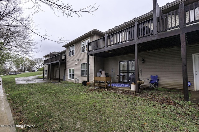 rear view of property with a lawn