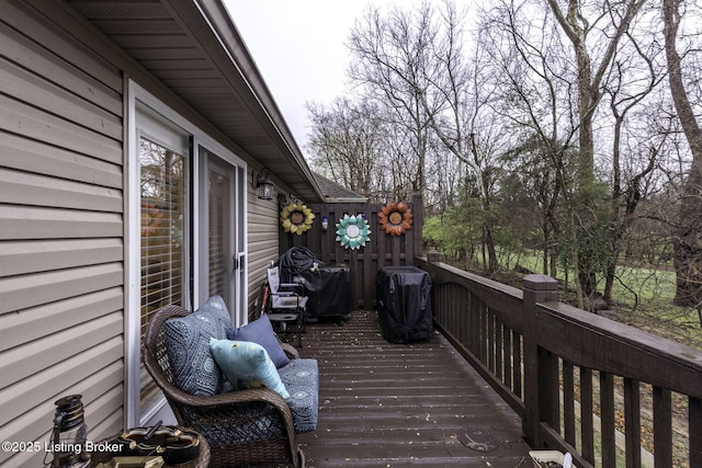 wooden deck with grilling area