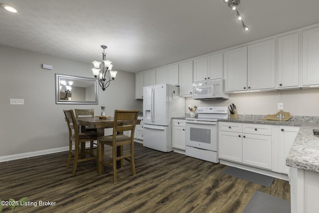 kitchen with white cabinetry, an inviting chandelier, baseboards, white appliances, and dark wood-style flooring