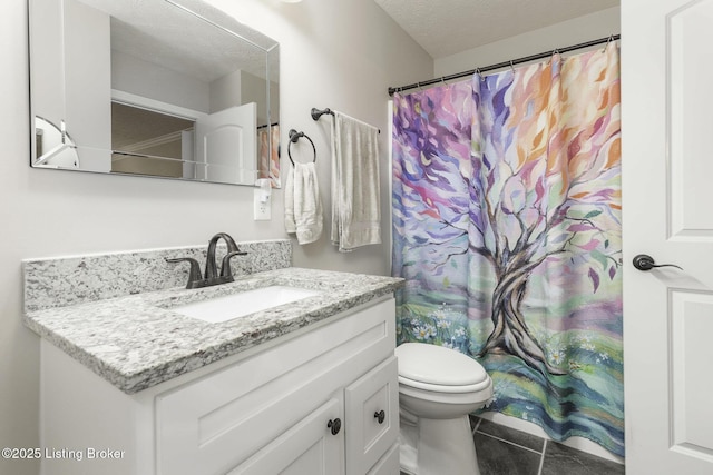 bathroom featuring a textured ceiling, a shower with shower curtain, toilet, tile patterned floors, and vanity
