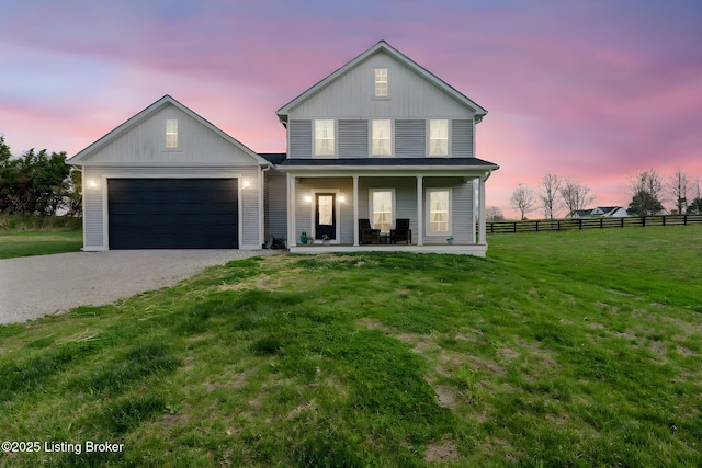 3965 Broadford Rd, Clarkson, KY 42726 - traditional-style house with a front yard, an attached garage, fence, gravel driveway, and a porch