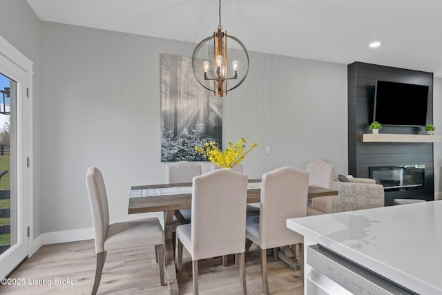 3965 Broadford Rd, Clarkson, KY 42726 - dining space with a wealth of natural light, a notable chandelier, light wood-style floors, and a fireplace