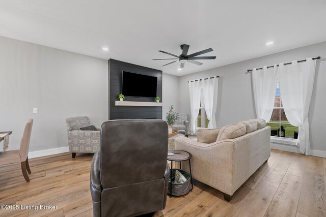 3965 Broadford Rd, Clarkson, KY 42726 - living area featuring baseboards, light wood-style floors, and ceiling fan