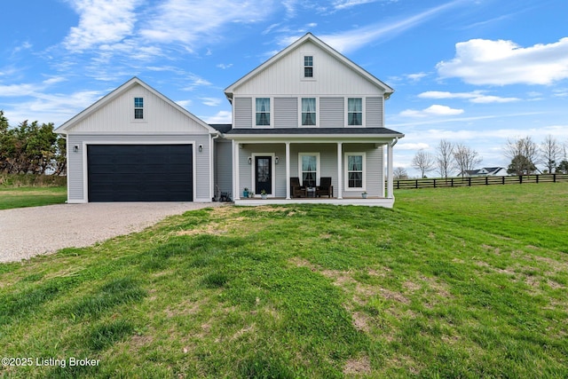 3965 Broadford Rd, Clarkson, KY 42726 - view of front facade with fence, a garage, a front lawn, driveway, and a porch