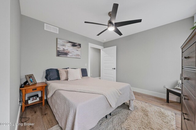 3965 Broadford Rd, Clarkson, KY 42726 - bedroom with baseboards, visible vents, wood finished floors, and ceiling fan