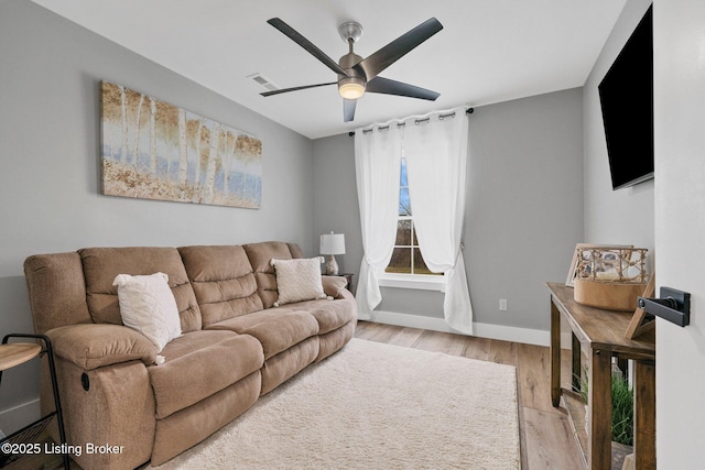 3965 Broadford Rd, Clarkson, KY 42726 - living room with baseboards, visible vents, light wood-style floors, and ceiling fan