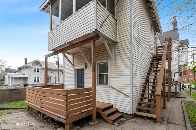 doorway to property featuring a wooden deck