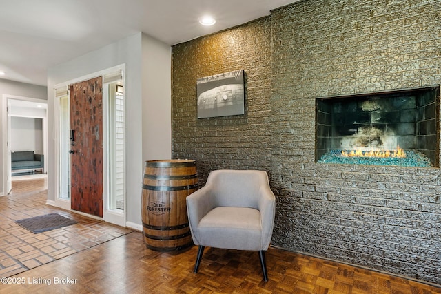 sitting room featuring recessed lighting and baseboards