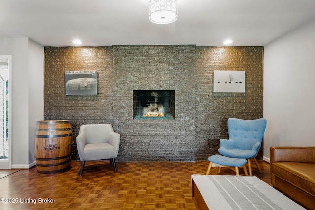 sitting room featuring baseboards and recessed lighting