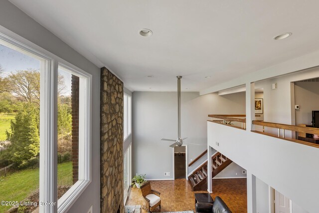 interior space featuring a towering ceiling and recessed lighting