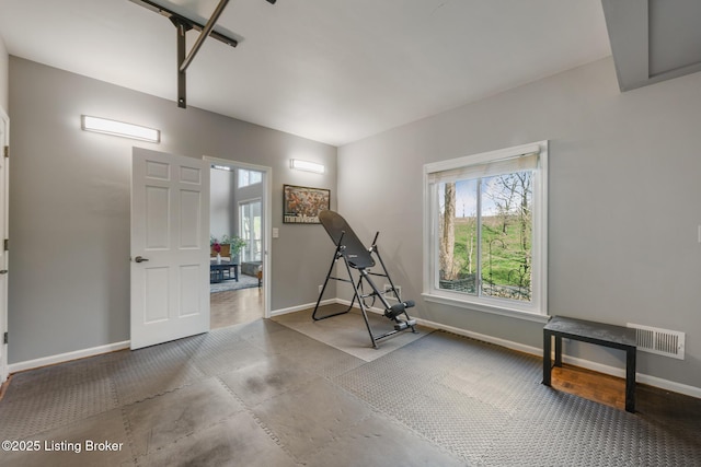 interior space featuring baseboards and visible vents
