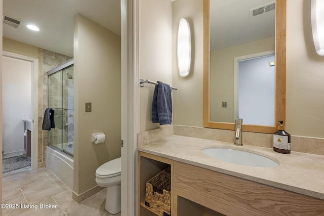 full bathroom with toilet, shower / bath combination with glass door, vanity, and visible vents