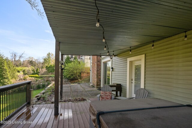 wooden deck with a patio