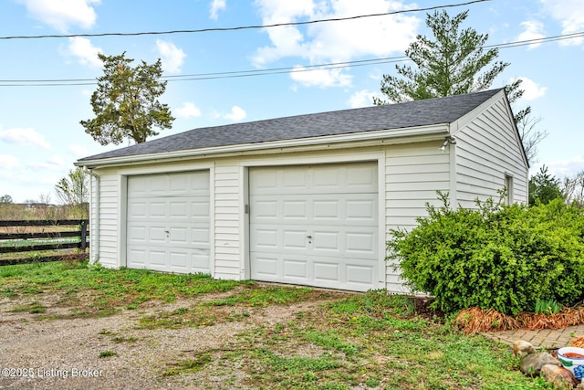 detached garage with fence