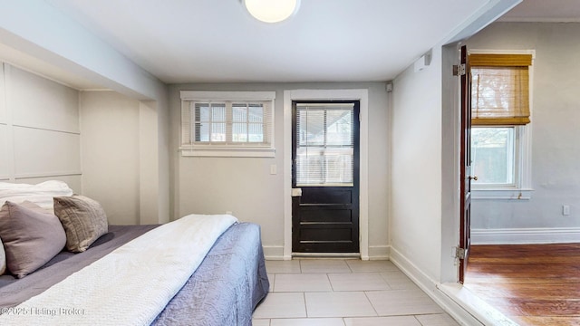 bedroom featuring multiple windows and baseboards